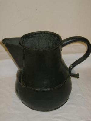 Appraisal: A COPPER JUG of baluster form with loop handle having