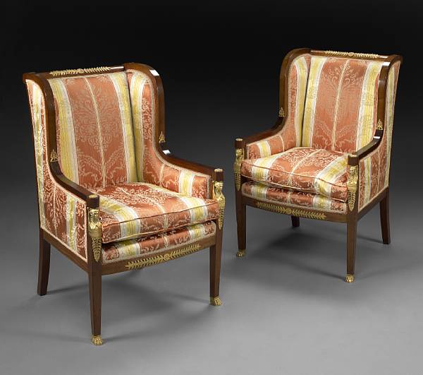 Appraisal: A pair of Empire style gilt bronze mounted mahogany bergeres