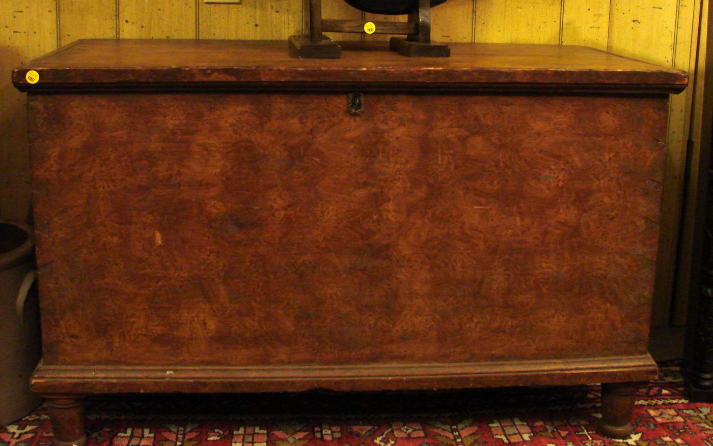 Appraisal: ANTIQUE AMERICAN LIFT-TOP BLANKET BOX In pine with grain-painted decoration