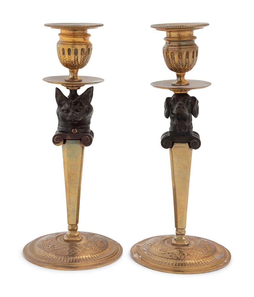 Appraisal: A Pair of Continental Gilt and Patinated Bronze Figural Candlesticks