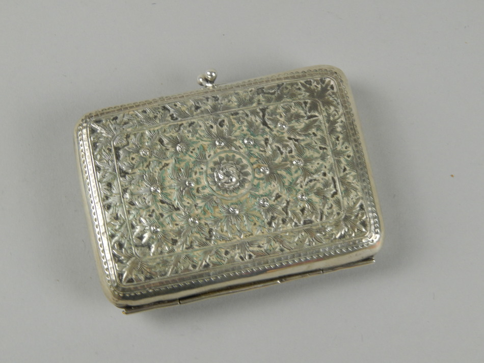 Appraisal: An Indian white metal purse with twist clasp decorated overall