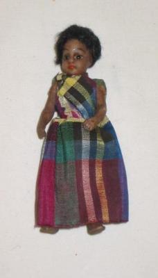 Appraisal: An all bisque Mulatto dolls house doll with fixed brown