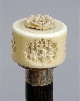 Appraisal: CHINESE CARVED IVORY-HANDLED STAINED WOOD WALKING STCIK The twist-off handle