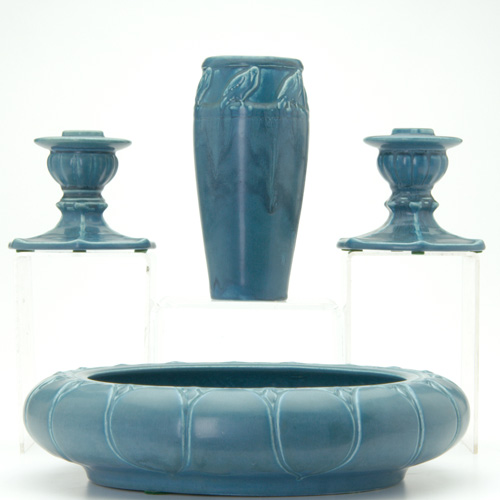 Appraisal: ROOKWOOD Four Production pieces in blue glaze pair of candlesticks