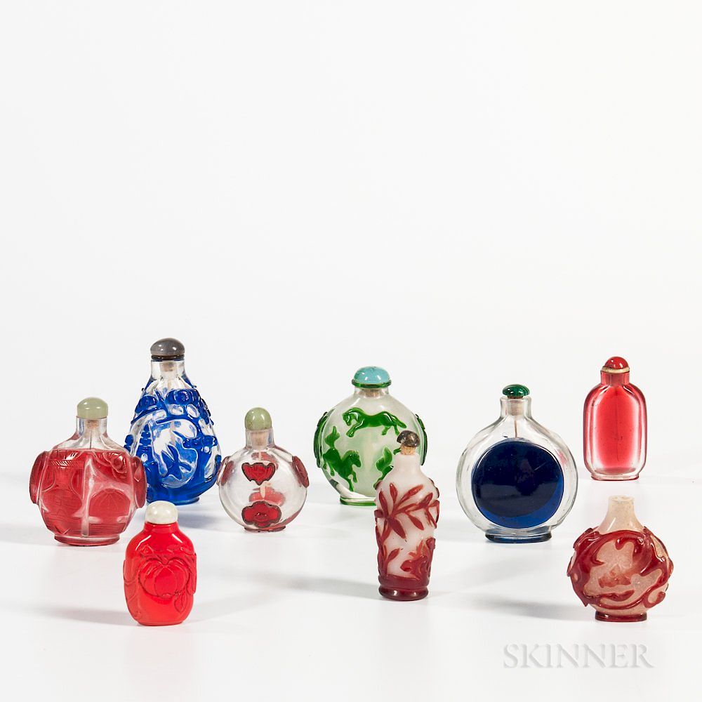 Appraisal: Nine Peking Glass Snuff Bottles Nine Peking Glass Snuff Bottles