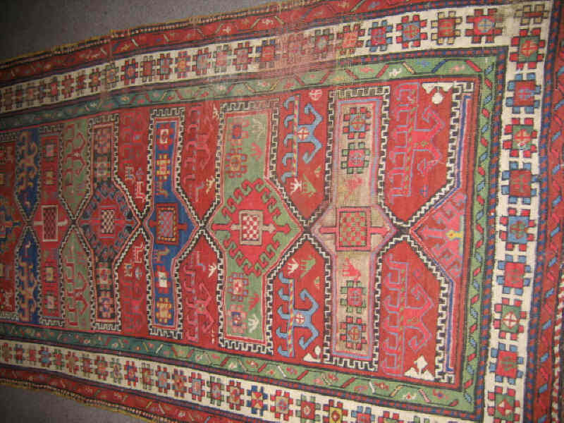 Appraisal: SHIRVAN TRIBAL LONG RUG The red field shows an intricate