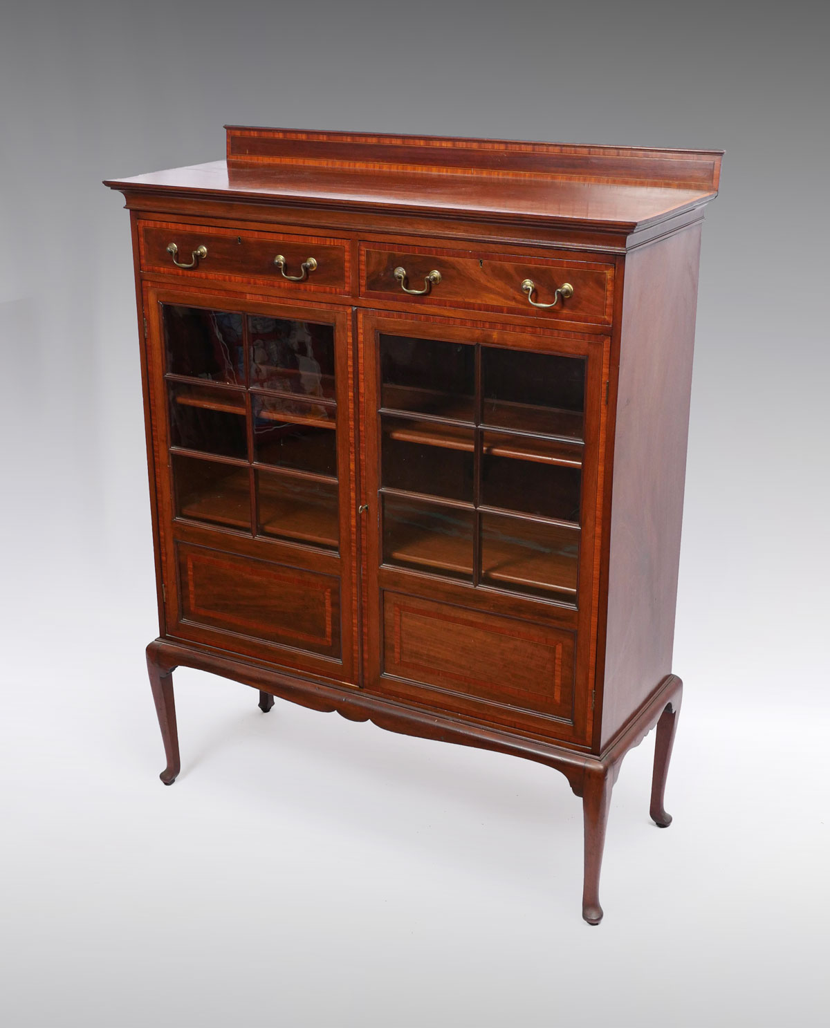 Appraisal: EDWARDIAN LIGHT TWO DOOR MAHOGANY BOOKCASE A fine petite flame