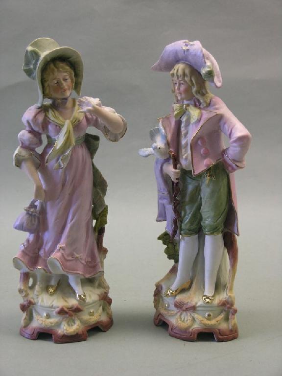 Appraisal: A pair of late th century French bisque statuettes male