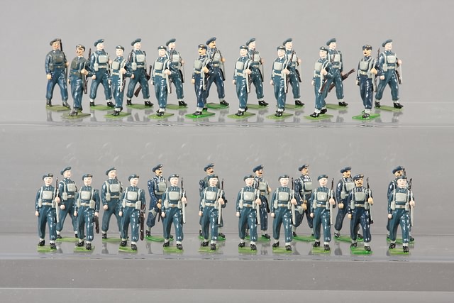 Appraisal: Lot of metal Royal Air Force figures marching with slung