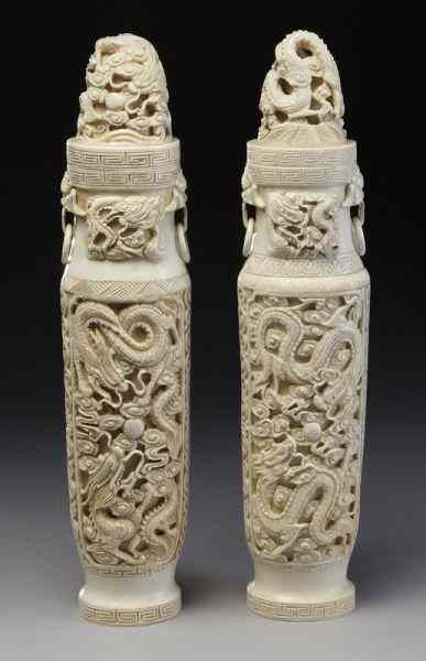 Appraisal: Pr Chinese carved ivory vases depicting dragons International buyers should