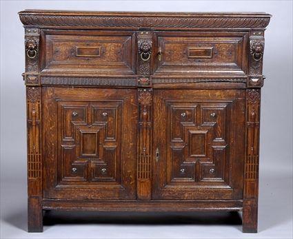 Appraisal: JACOBEAN-STYLE CARVED AND INLAID OAK TWO-PART CABINET The upper part