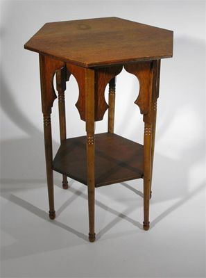 Appraisal: An oak Moorish table probably retailed by Liberty and Co