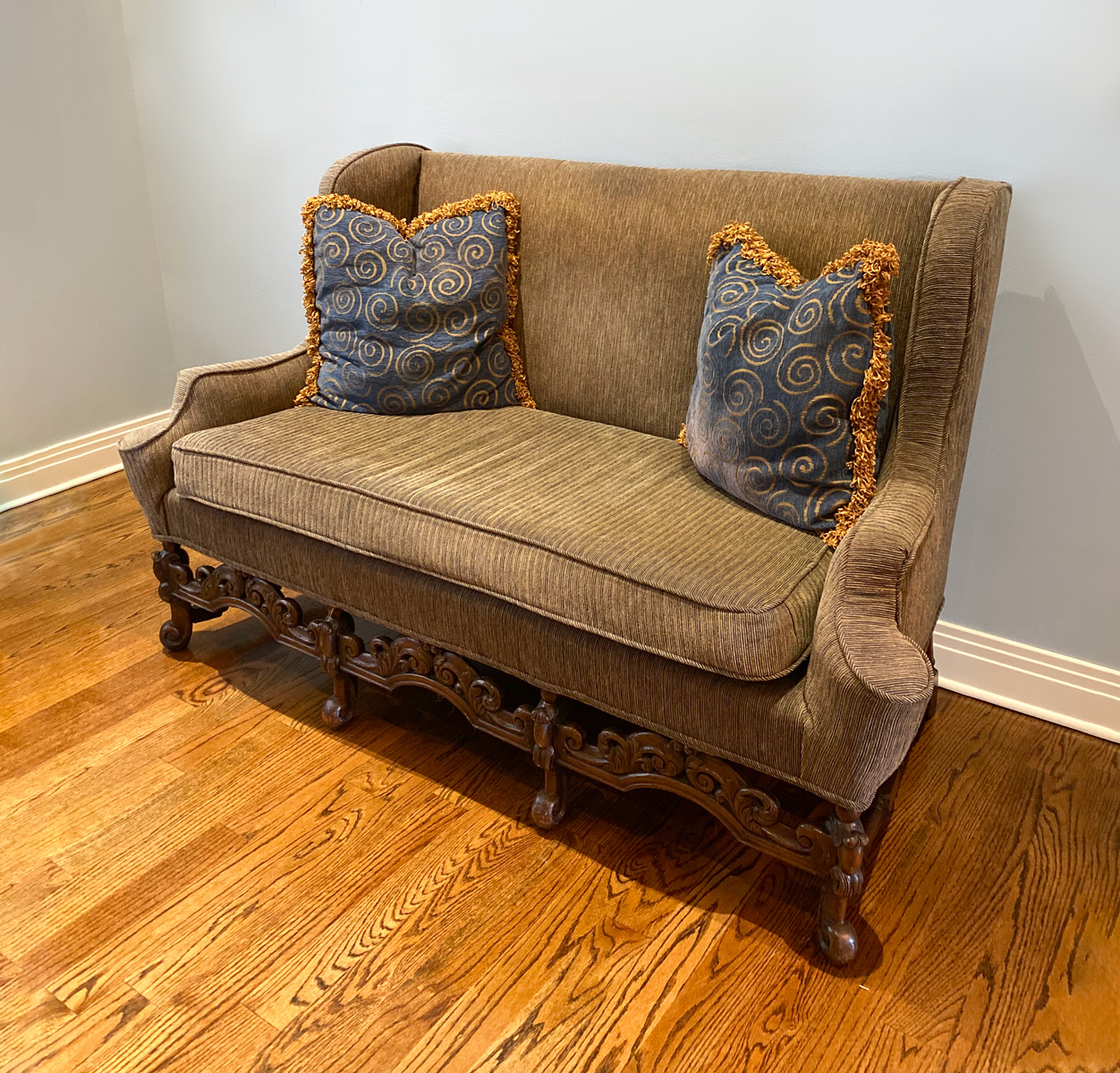 Appraisal: CARVED SETTEE Settee upholstered in a ribbed brown fabric Carved