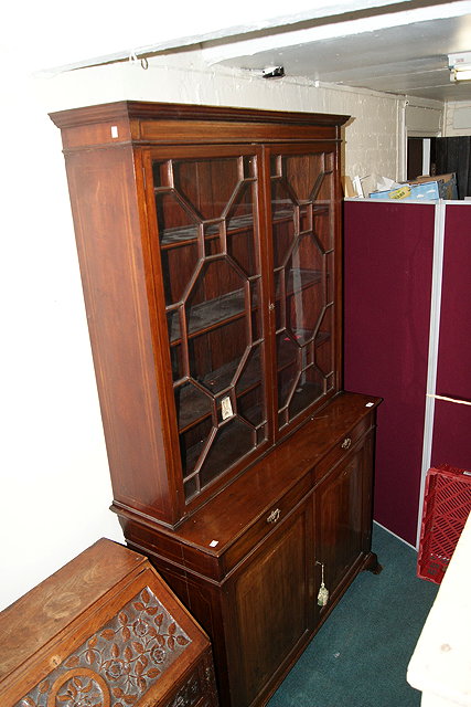 Appraisal: AN EDWARDIAN MAHOGANY AND INLAID BOOKCASE the upper part fitted