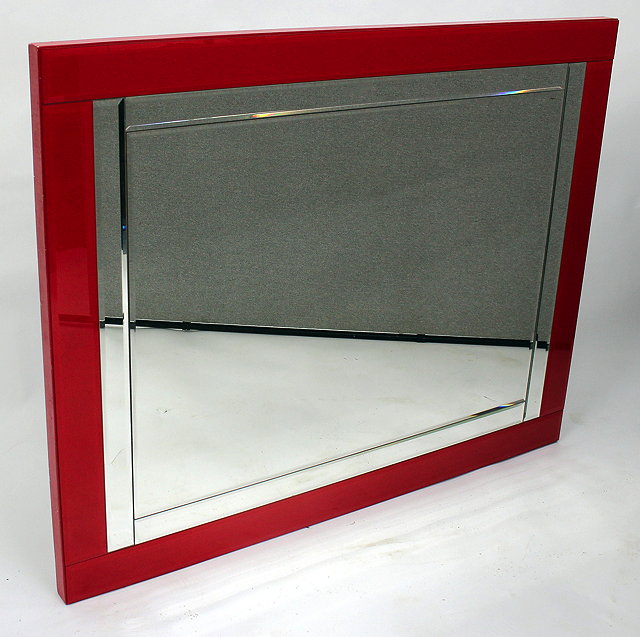 Appraisal: A RECTANGULAR RED FRAMED BEVELLED GLASS WALL MIRROR cm x