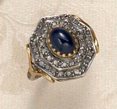 Appraisal: SAPPHIRE AND DIAMOND RING Silver and gold ring with oval