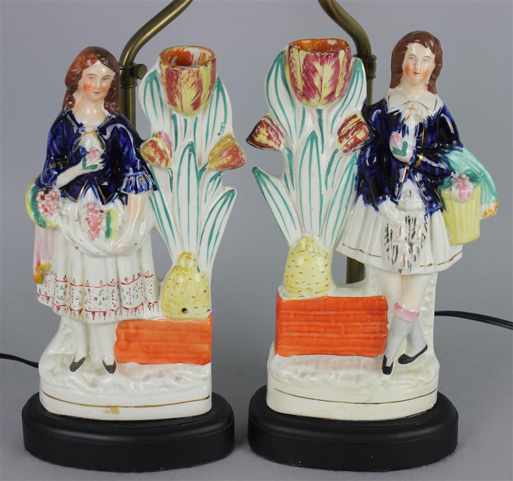 Appraisal: PAIR OF STAFFORDSHIRE FLATBACK FIGURES WITH SPILL VASES late th