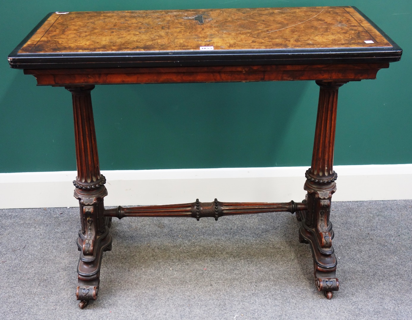 Appraisal: A Victorian burr walnut card table the rectangular fold over