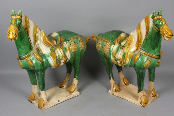 Appraisal: Pair of green Tang-style horses h x w x d