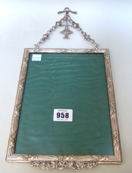 Appraisal: A silver mounted rectangular photograph frame the reeded borders decorated