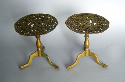 Appraisal: Pair of Victorian brass kettle stands together with a doorstop