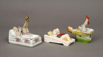 Appraisal: Three Porcelain and Pottery Risqu Bobbing Female Figures to x