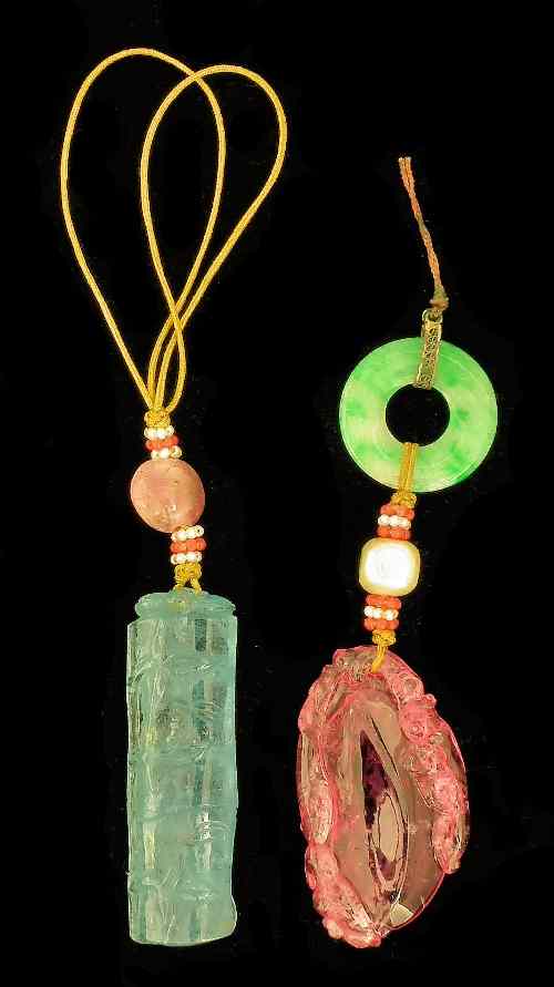 Appraisal: A coloured hardstone pendant carved with bamboo with attached hardstone