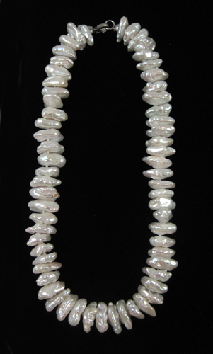 Appraisal: PRINCESS LENGTH BAROQUE PEARL NECKLACE strung with baroque white pearls