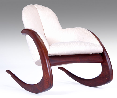 Appraisal: WENDELL CASTLE Walnut Crescent rocking chair with ecru fabric Signed