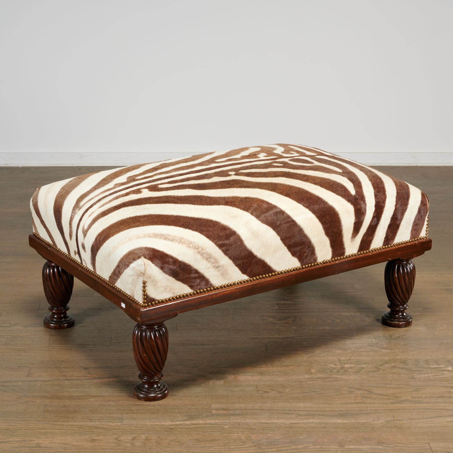 Appraisal: WILLIAM IV STYLE ZEBRA HIDE UPHOLSTERED OTTOMAN th th England