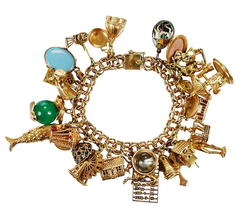 Appraisal: Gold Charm Bracelet assorted charms four kt fifteen kt nine