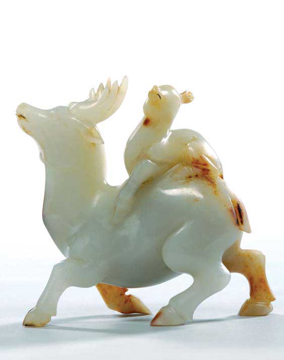 Appraisal: CARVED WHITE JADE DEER Well carved Chinese white jade model