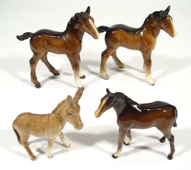 Appraisal: Three hand painted Beswick foals and a Beswick donkey factory