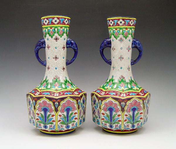 Appraisal: PAIR LONGWY FRENCH FAIENCE VASES Double elephant form handles ''