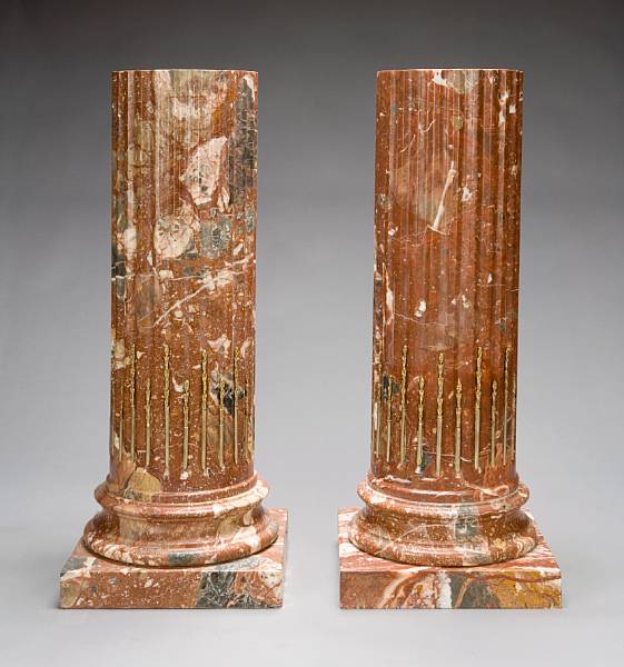 Appraisal: A pair of gilt bronze mounted rouge marble columnar pedestals