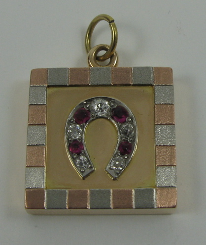 Appraisal: RUBY DIAMOND AND FOURTEEN KARAT GOLD PENDANT the square shaped