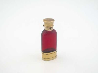 Appraisal: A Victorian silvergilt mounted ruby glass scent bottle and vinaigrette