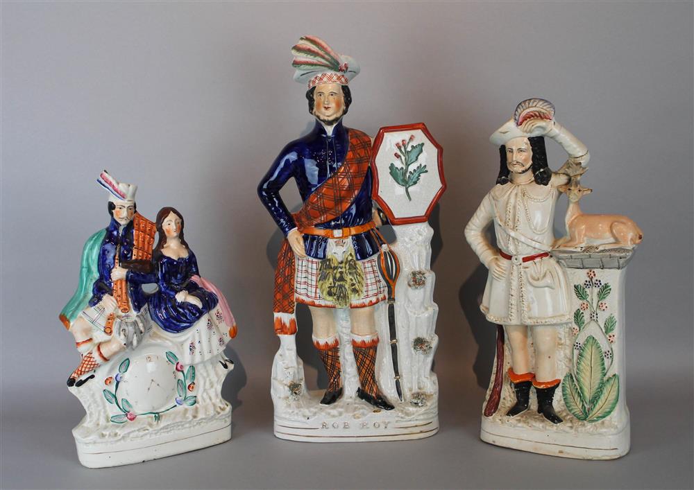 Appraisal: THREE LARGE STAFFORDSHIRE FIGURE GROUPS the first Rob Roy in