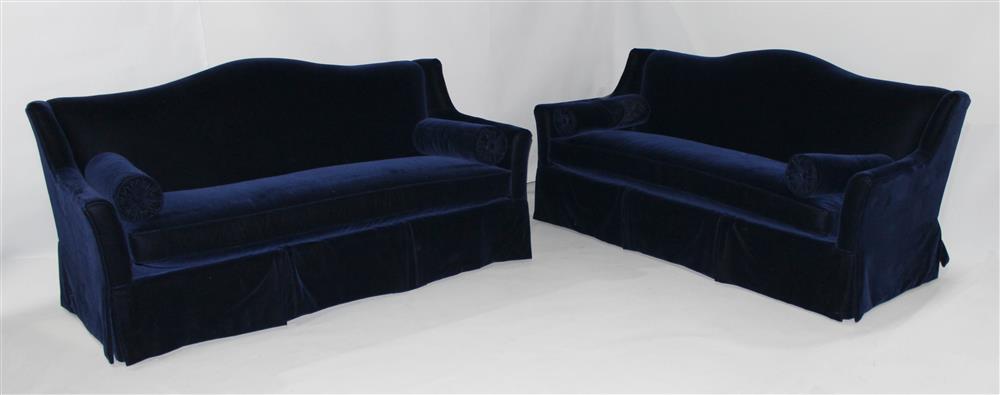 Appraisal: PAIR OF DAPHA BLUE MOLESKIN CAMELBACK SOFAS WITH BOLSTERS both