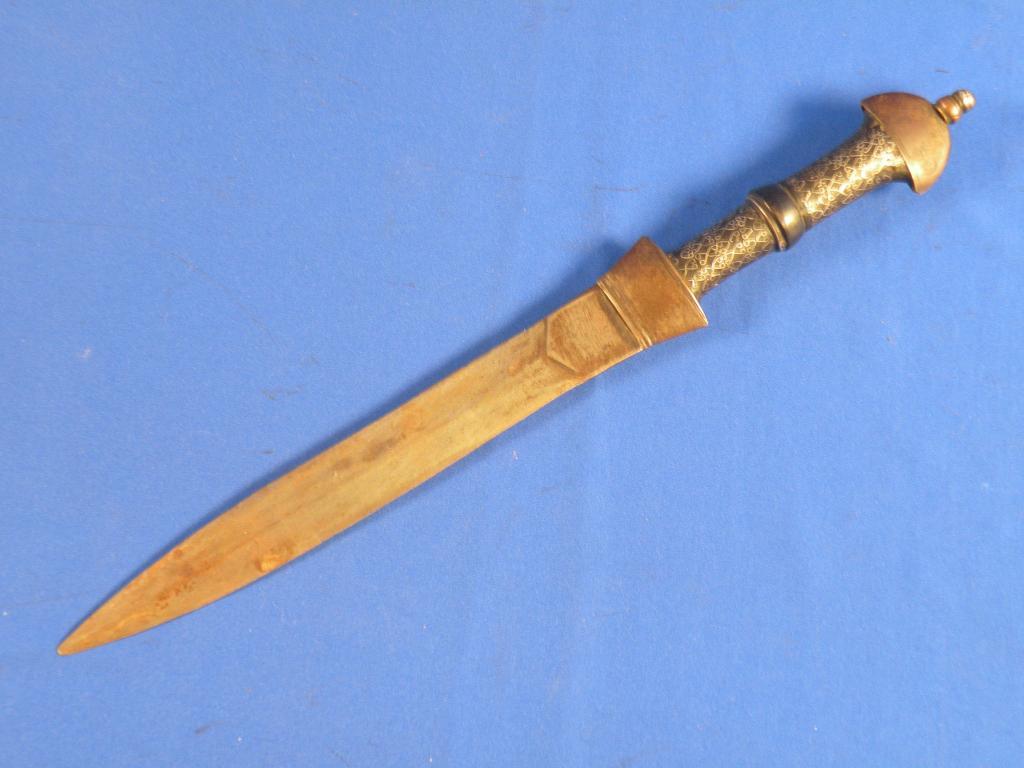 Appraisal: A Middle Eastern dagger the composition handle inlaid with silver