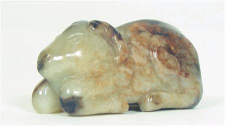 Appraisal: A Chinese pale and dark brown jade ram Qing Dynasty