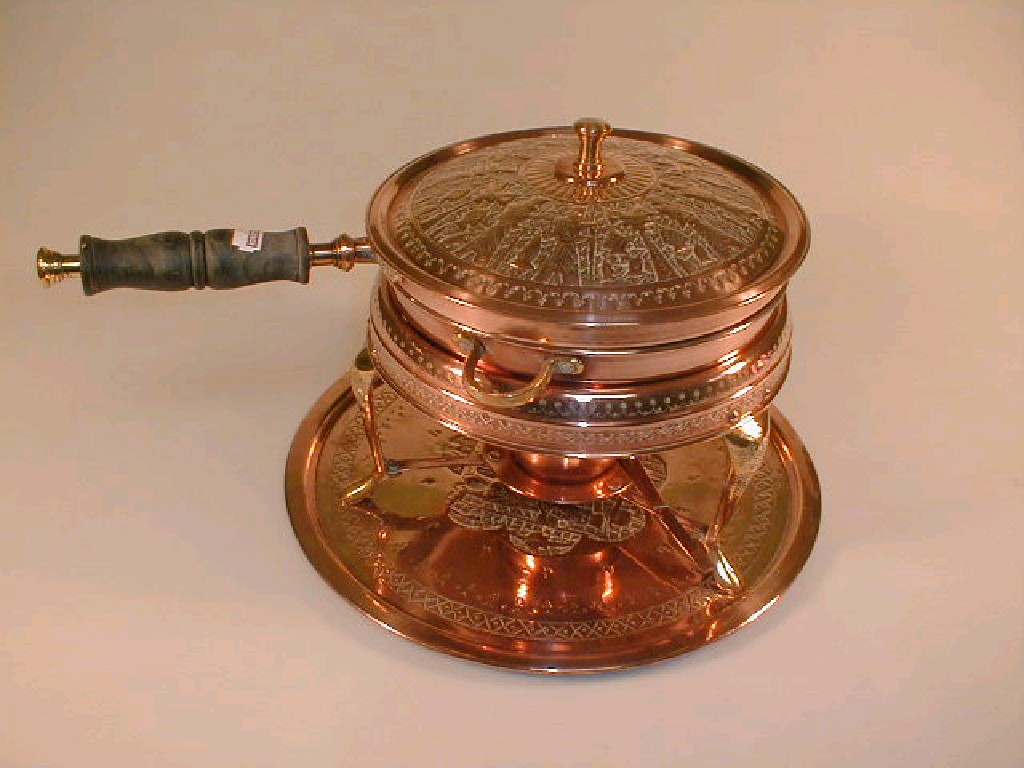 Appraisal: An Indian pressed copper chafing dish stand and tray the