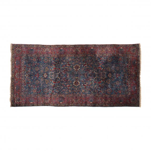 Appraisal: SAROUK RUG Blue field with large floral and palmette motifs