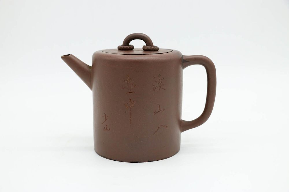 Appraisal: YIXING CYLINDRICAL TEAPOT A zisha teapot of tall cylindrical form