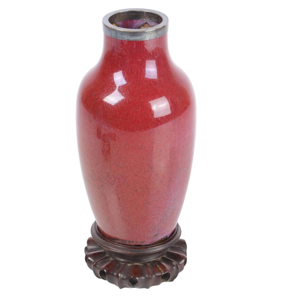 Appraisal: CHINESE OXBLOOD GLAZED PORCELAIN BALUSTER VASE WITH SILVER RING REPAIR