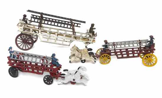 Appraisal: Three Cast Iron Fire trucks two with horses Length of