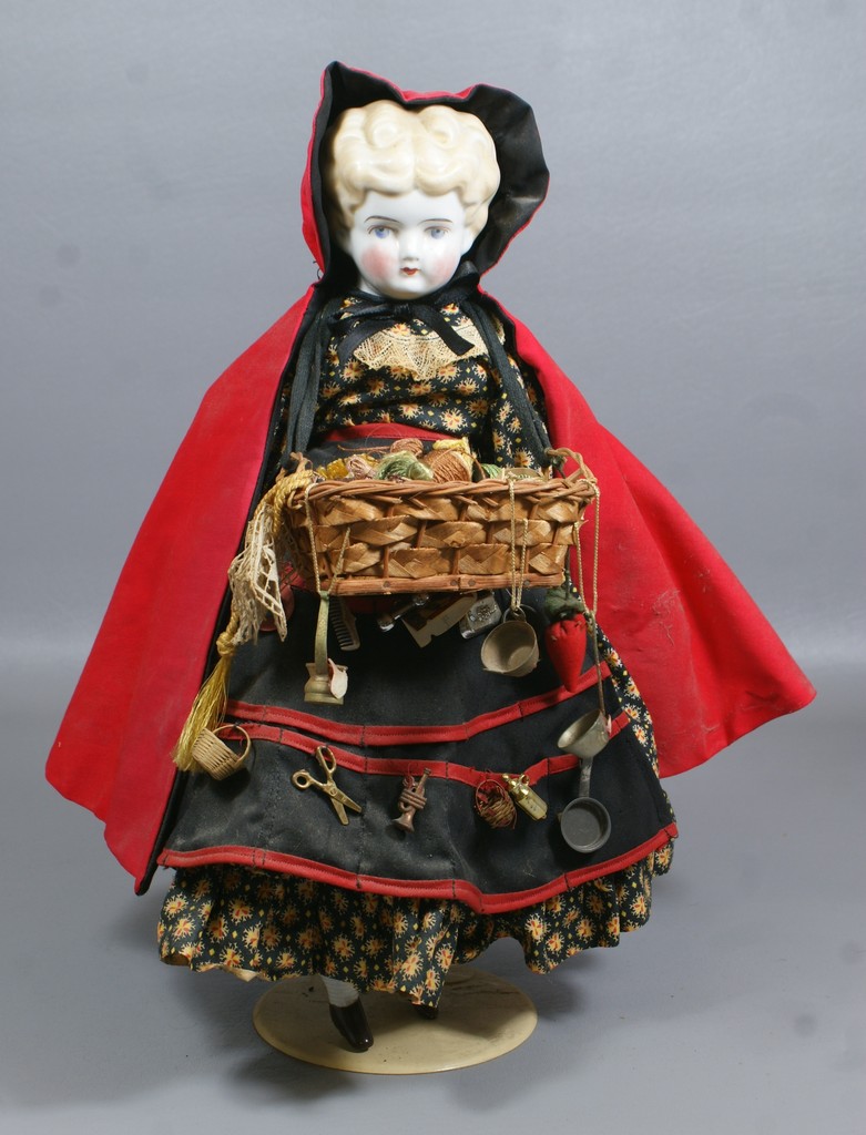 Appraisal: Antique Blond Low Brow China Doll dressed in red cape