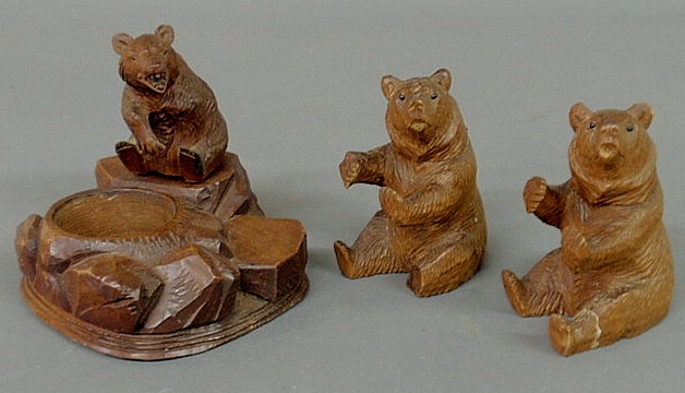 Appraisal: Three carved Black Forest bears two with hinged lid heads