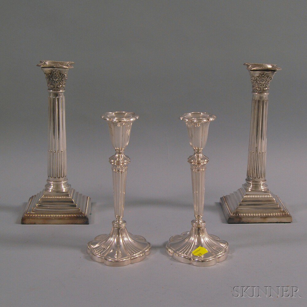 Appraisal: Two Pairs of Silver-plated Candlesticks a smaller pair with petal-form