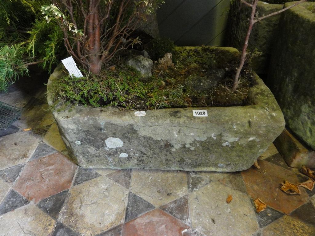 Appraisal: A small weathered natural stone garden trough of rectangular form